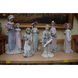Four Lladro figures, largest 32.5cm high; together with two other similar figures.