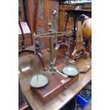 A set of mahogany and brass balance scales, by W & T Avery, the apron drawer stamped 'Maples &