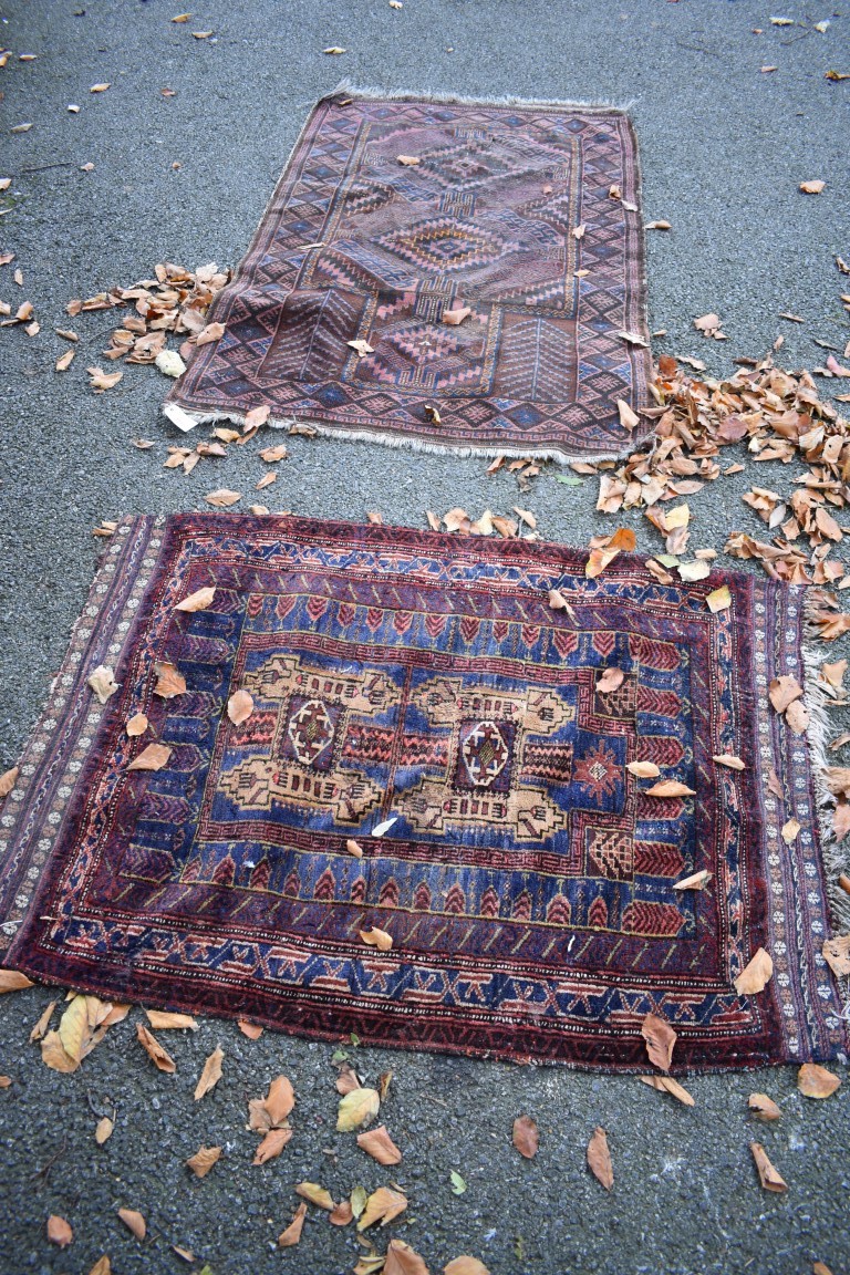 Two old Persian rugs, having geometric design, largest 155 x 96cm.