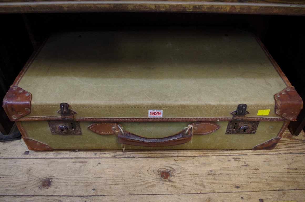 A mixed collection of World War II items and ephemera, in vintage canvas suitcase.