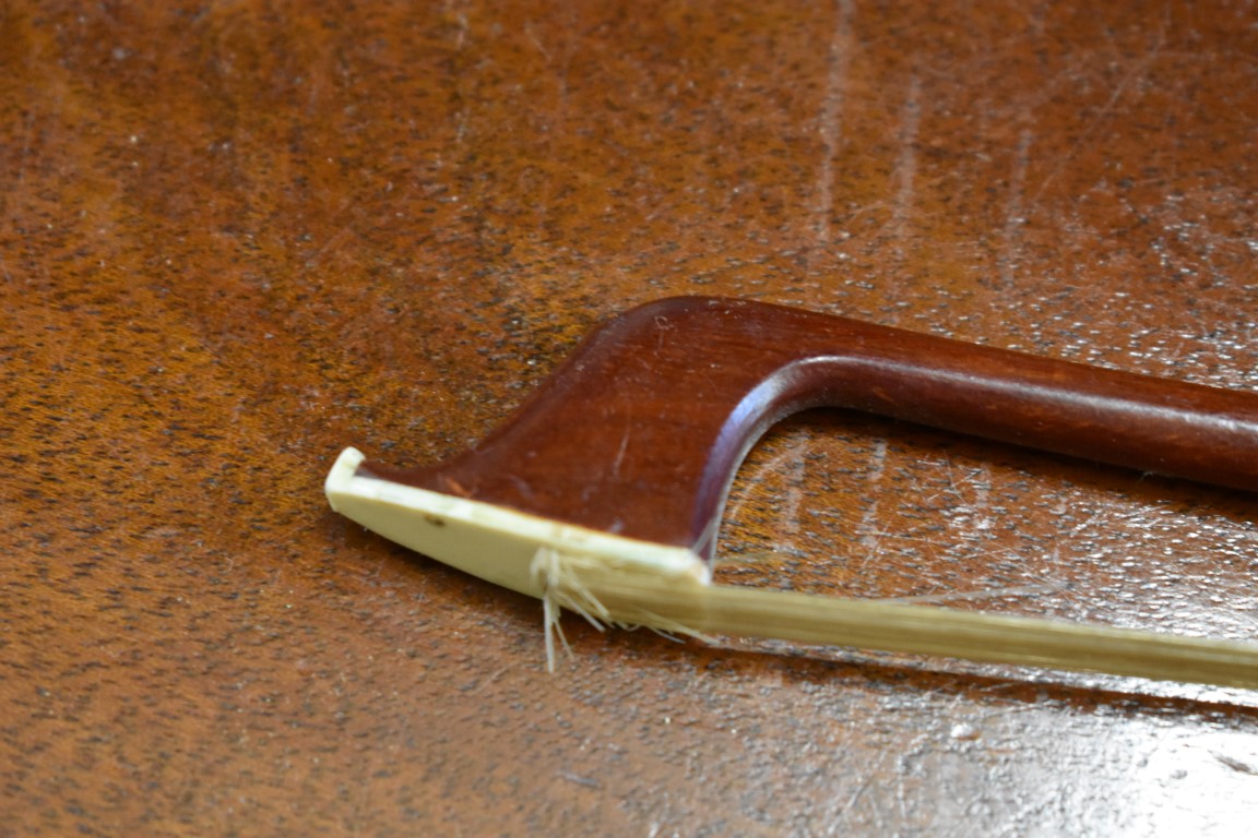 A violin bow, stamped 'M Kirschmann', 71.5cm long. - Image 7 of 7