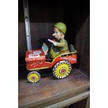 A vintage tin plate clockwork 'GI Joe Jouncing Jeep' toy.