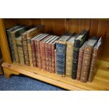 Books: a small collection of leather bindings and others.