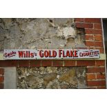 A 'Smoke Wills's "Gold Flake" Cigarettes' enamel sign, 10.5 x 101.5cm.