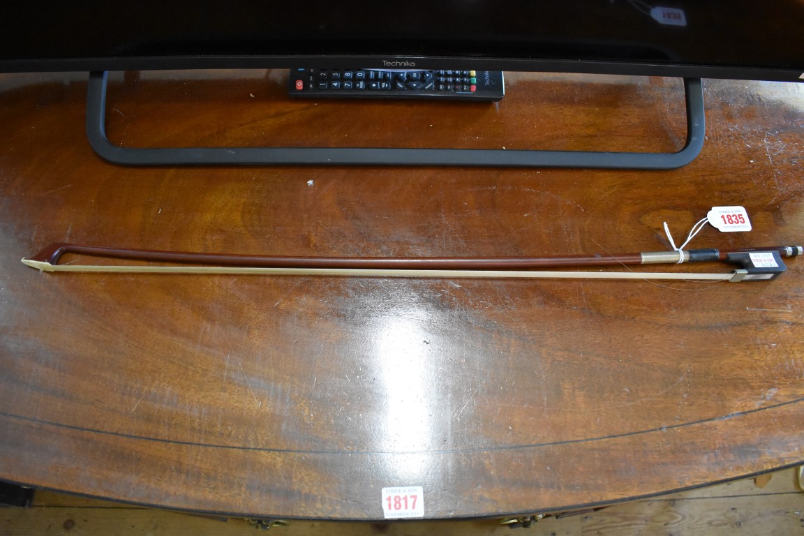 A violin bow, stamped 'M Kirschmann', 71.5cm long.