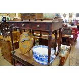 A Regency mahogany washstand, on reeded legs, 106.5cm wide, with brass castors.