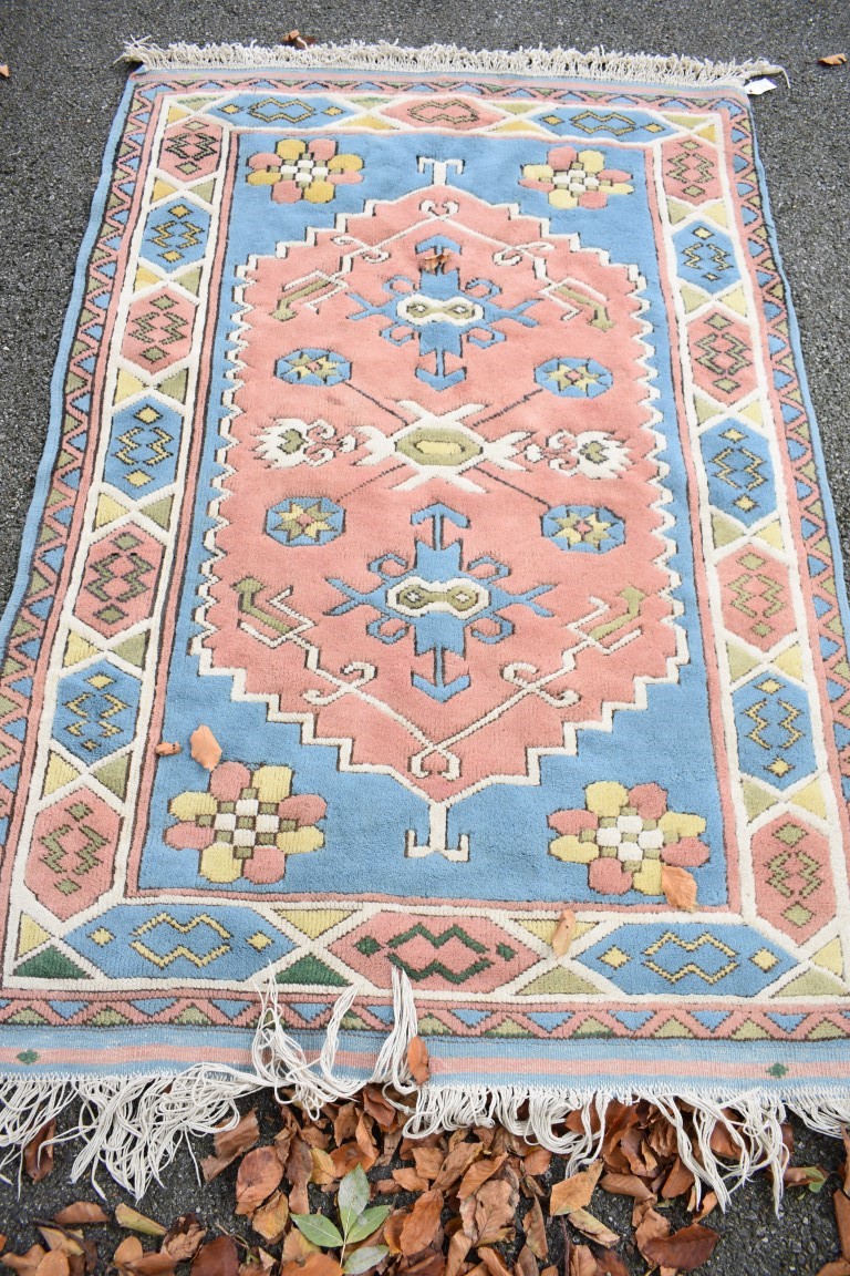 An Eastern rug, having geometric design, 200 x 126cm.