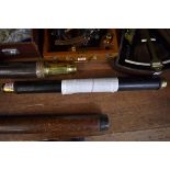 An antique brass and leather single drawer telescope, inscribed 'Commander E H Scott, H M Ship