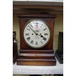 An oak mantel clock, the repainted dial inscribed 'Barrauds, Corn Hill, London', with twin fusee