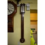 An antique mahogany and line inlaid stick barometer, the silvered dial inscribed 'J Giobbio & Co,