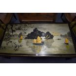 An Oriental painted rectangular low occasional table, 128cm wide.