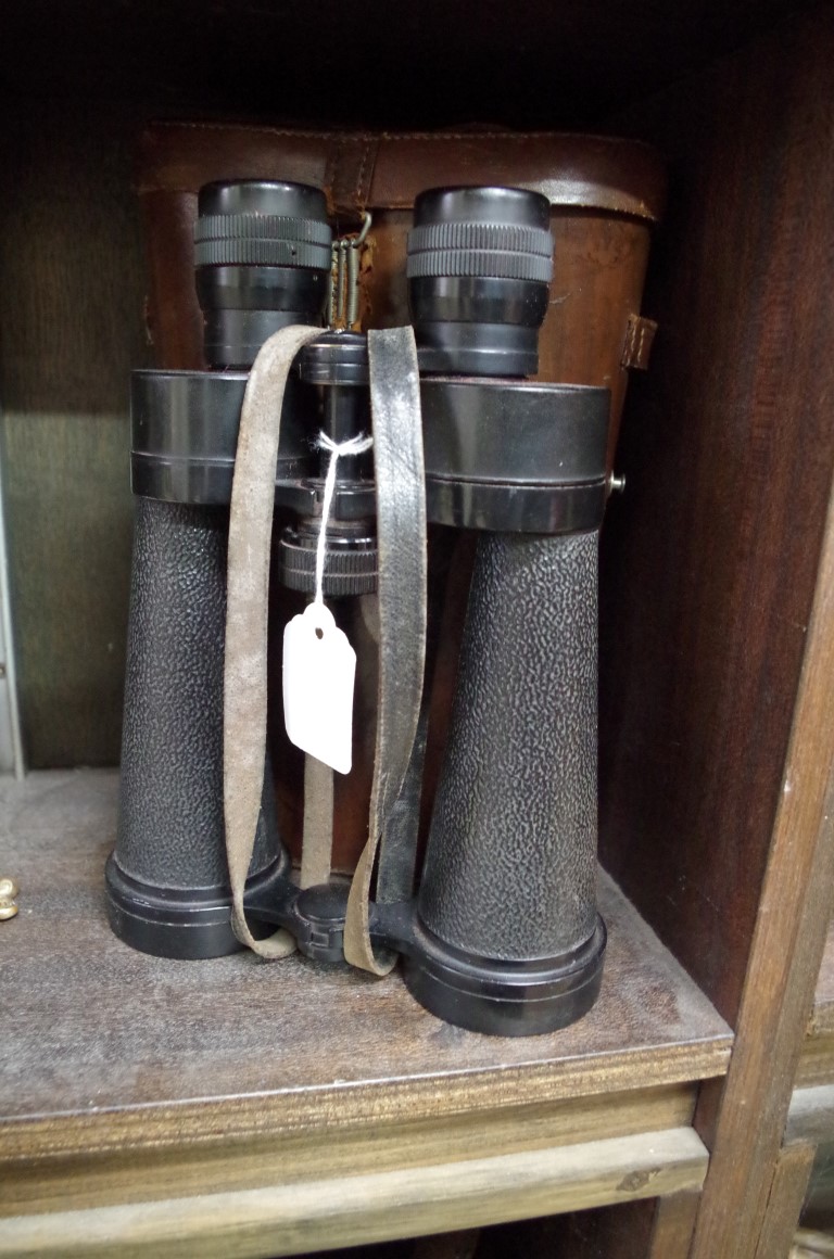 A pair of Barr & Stroud 10x binoculars, in leather case.