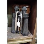 A pair of Barr & Stroud 10x binoculars, in leather case.