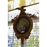 A 19th century gilt wood framed convex wall mirror, total height 95cm.