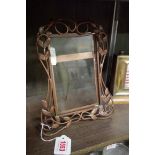 A Continental Art Nouveau copper easel back frame, 24 x 18cm.