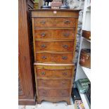 A reproduction walnut bowfront chest on chest, 63.5cm wide.