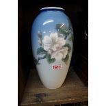 A Royal Copenhagen vase, painted with flowers, 27.5cm high.