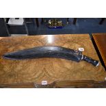 A large Nepalese Gurkha panawal sirupate kukri and scabbard, having 59cm blade.