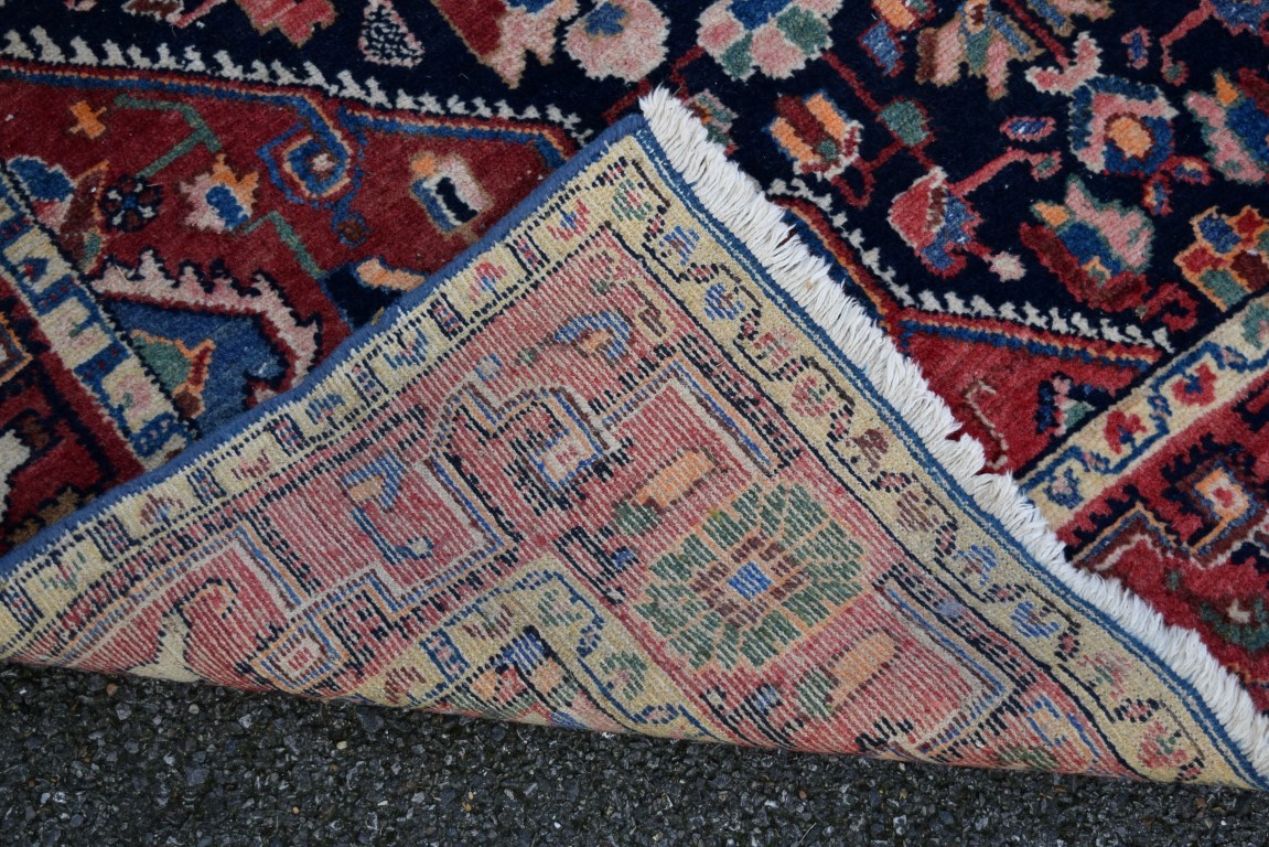 An Iranian rug, having red field with geometric design, 242 x 132cm. - Image 3 of 3