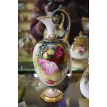 A Royal Worcester ewer, circa 1920, painted with roses, 21cm high.