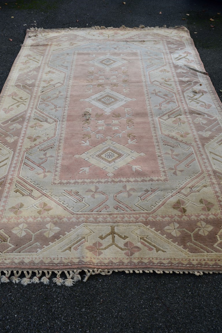 A Turkish wool carpet, having geometric decoration, 367 x 244cm.