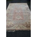 A Turkish wool carpet, having geometric decoration, 367 x 244cm.