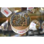 A 19th century pot lid and base, decorated with bear, lion and cockerel, 7.5cm wide.