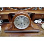 A 1930s mahogany and inlaid Westminster chiming Napolean clock, 43cm wide, with pendulum.