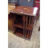 An Edwardian mahogany and inlaid revolving bookcase, 49cm wide.