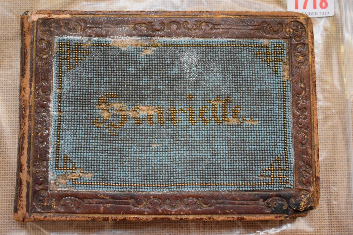 A Victorian album, the cover beadwork decorated with the name Henriette.