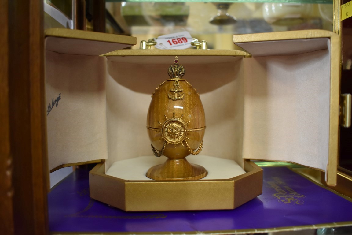 A Theo Faberge limited edition silver gilt and oak 'Shtandart Egg', No.134, in fitted case.