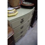 An antique cream painted bow front chest of drawers, 100.5cm wide.