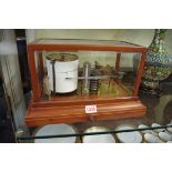 A stained mahogany barograph, with apron chart drawer.