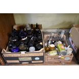 A collection of glass apothecary bottles and other related items.