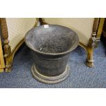 A very large antique cast iron mortar, 29cm high x 35.5cm diameter.