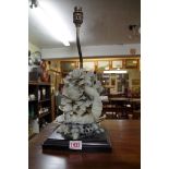 A pair of Chinese carved soapstone mounted table lamps, the soapstone 20cm high, (one repaired).