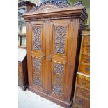 A Victorian carved mahogany double wardrobe, 127cm wide.