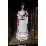 A rare Staffordshire pottery figure of Queen Victoria, 33cm high.