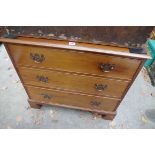 An old mahogany three drawer chest, 80cm wide.