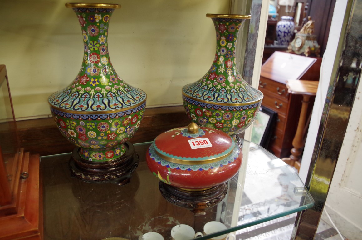 A pair of Chinese cloisonne enamel vases, 25.5cm; together with a similar bowl and cover, each on