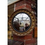 A reproduction gilt framed convex wall mirror, 41.5cm diameter.
