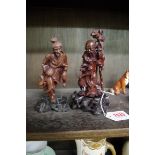 Two Japanese carved wood figures, largest 16cm high.