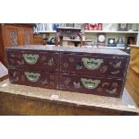 A Japanese lacquer small four drawer chest, 61cm wide.