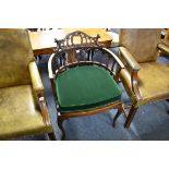 A circa 1900 mahogany armchair, with studded leather seat.