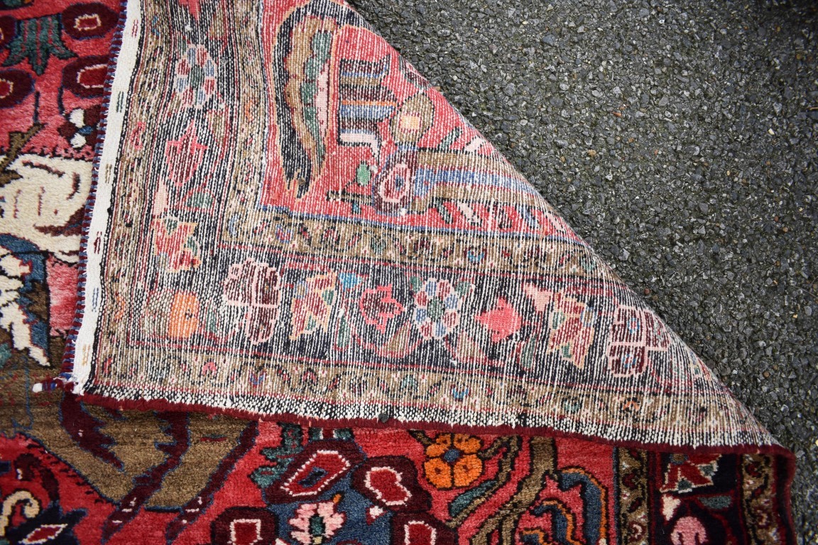 An Eastern rug, having animal motifs on a red field, with floral borders, 320 x 127cm. - Image 3 of 3