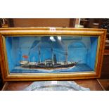 A painted diorama of a paddle steamer, in a bird's eye maple frame, 64cm wide.