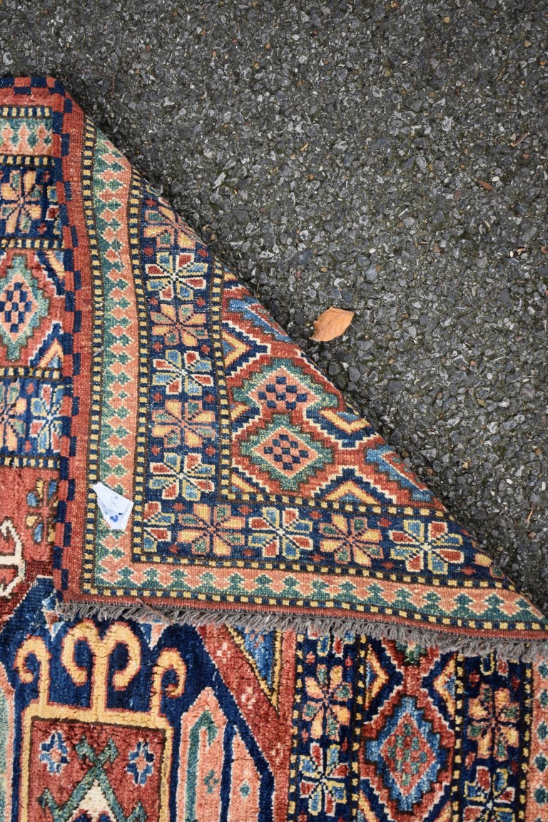 A Persian rug, having three central medallions with floral and geometric borders, 154 x 144cm. - Image 3 of 3