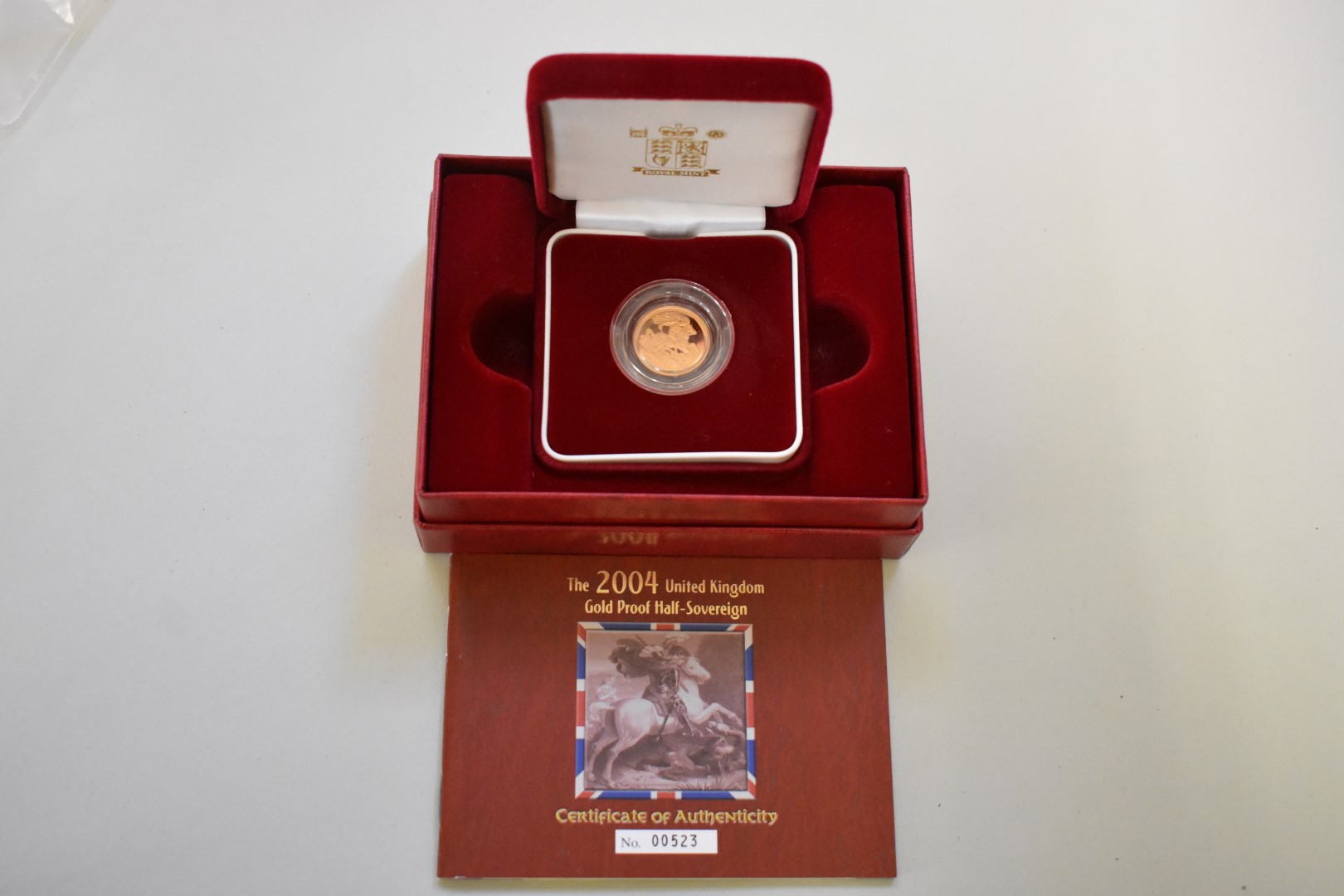 An Elizabeth II 2004 gold proof half sovereign, boxed.