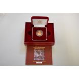 An Elizabeth II 2004 gold proof half sovereign, boxed.