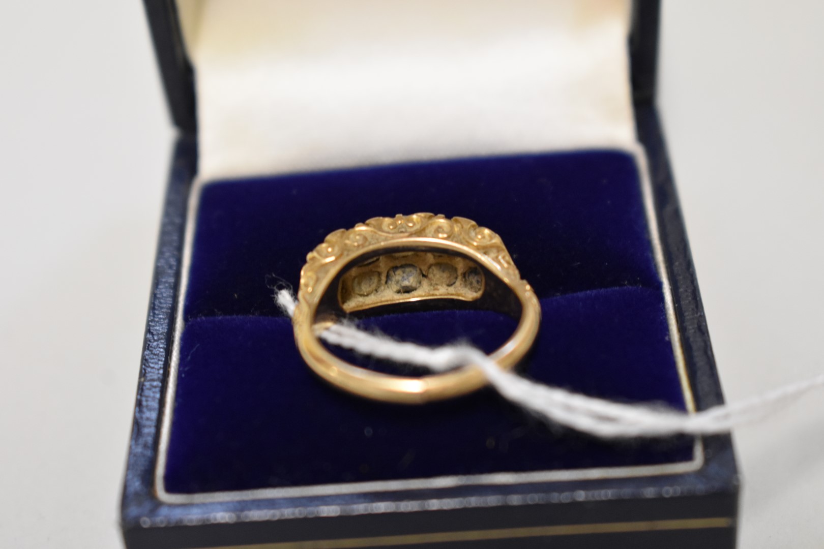 A sapphire and diamond gold ring, hallmarked 18ct, 4.2g total weight, (shank cut). - Image 2 of 2